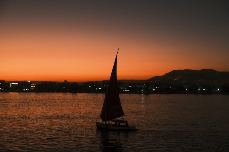 A felucca sailing on the Nile at sunset